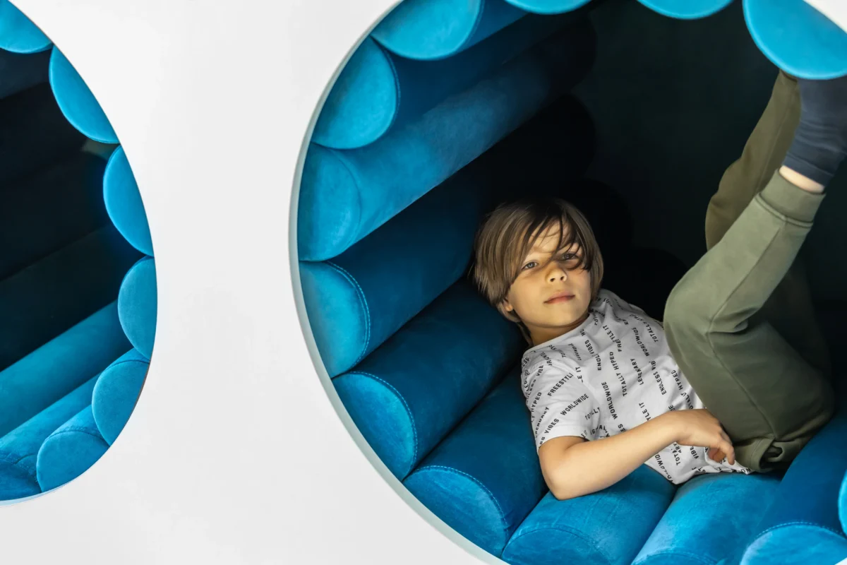 Happy child receiving dental treatment in a pediatric dentistry clinic, project created by SPACE DESIGN for Solonlo Sovyak