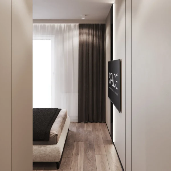Wall-mounted TV with backlighting opposite the bed and a curtained window