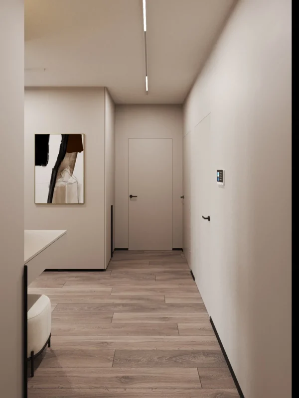 Corridor with light walls, artwork and flush-mounted doors
