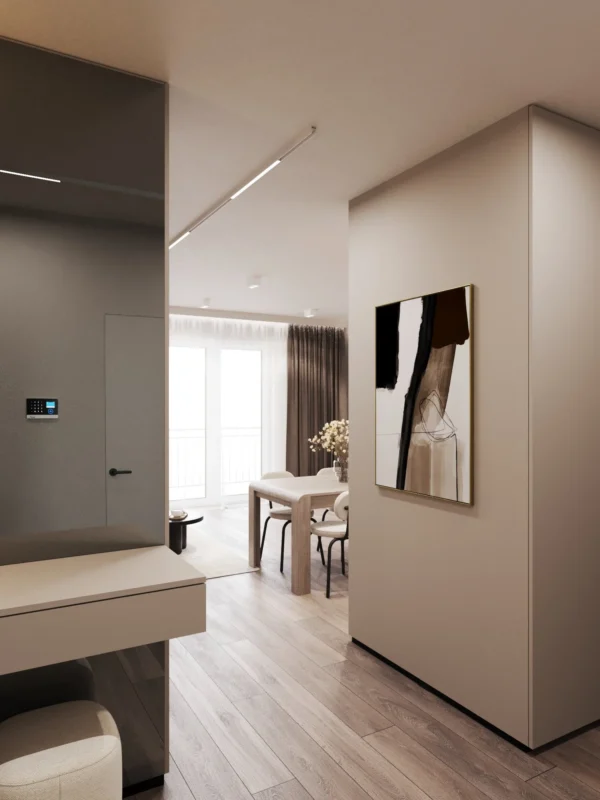 Passage from the hall to the living room: a wall with artwork and the dining area beyond
