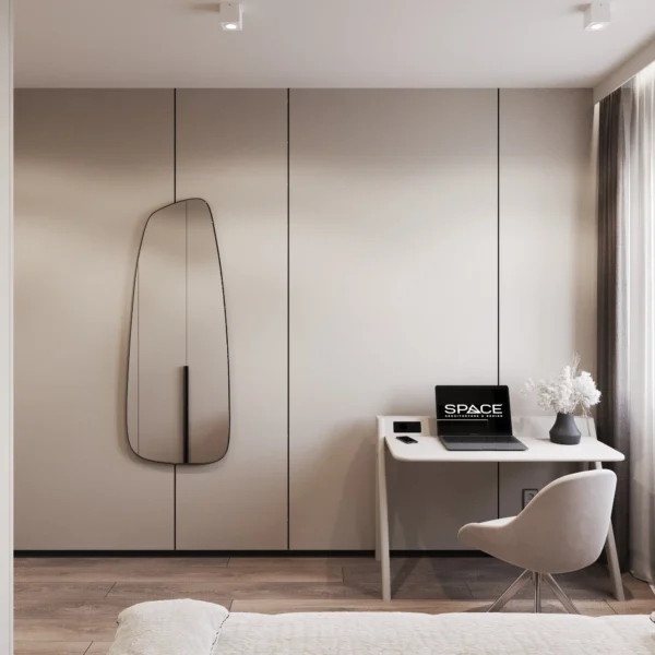 Desk and an organic-shaped mirror on the wardrobe front in the kids' room