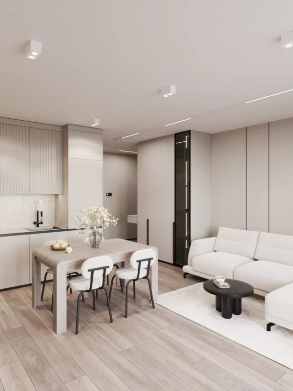 Kitchen-living room: oak-top dining table, a kitchen with fluted fronts and a sofa