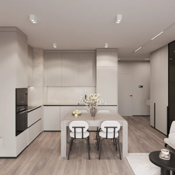 Kitchen with a built-in appliance column, dining table and the doorway to the hall