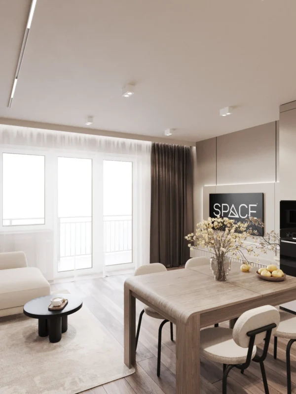 Dining table by the window, sofa and TV area in the kitchen-living room