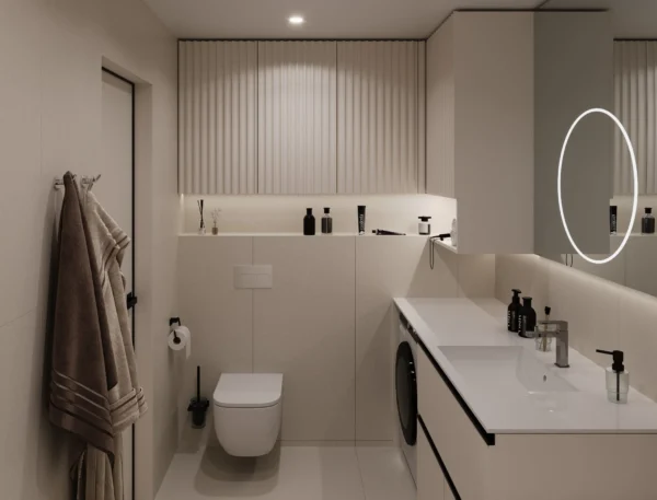 Washbasin on a vanity with a built-in washing machine and fluted cabinet fronts