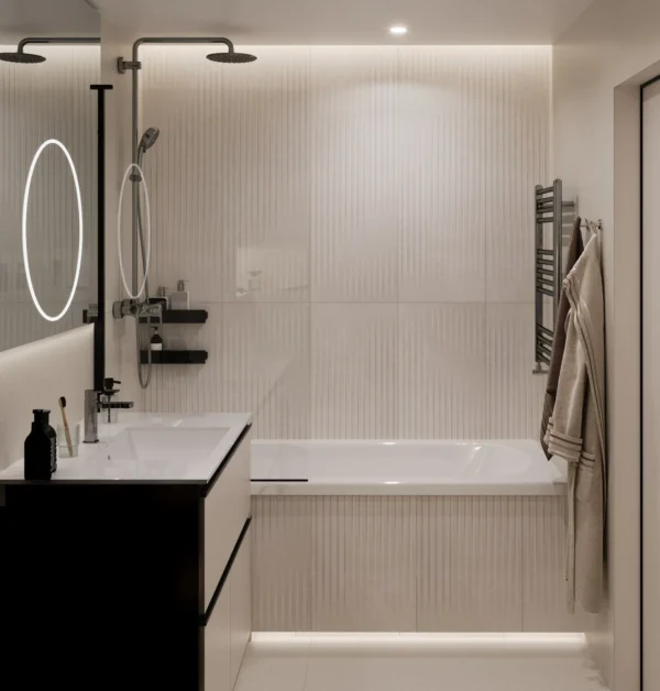 Bath with a rain shower, fluted tiles and a backlit mirror above the washbasin