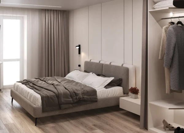 Bed by the curtained window and an open walk-in wardrobe behind a fabric curtain