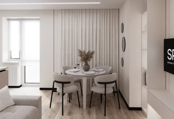 Dining area: a round white table and chairs with black legs against light curtains