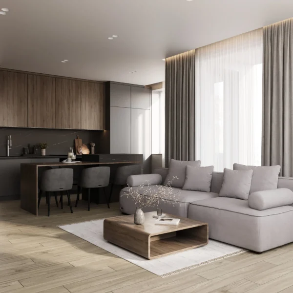 Salon z aneksem: szara sofa modułowa, drewniany stolik kawowy i kuchnia z barem
