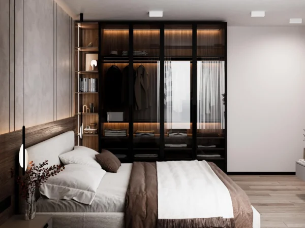 Glass-front wardrobe with built-in lighting next to the bed