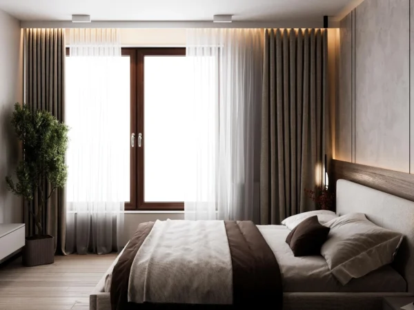 Bed by the window with curtains in an LED-lit ceiling recess