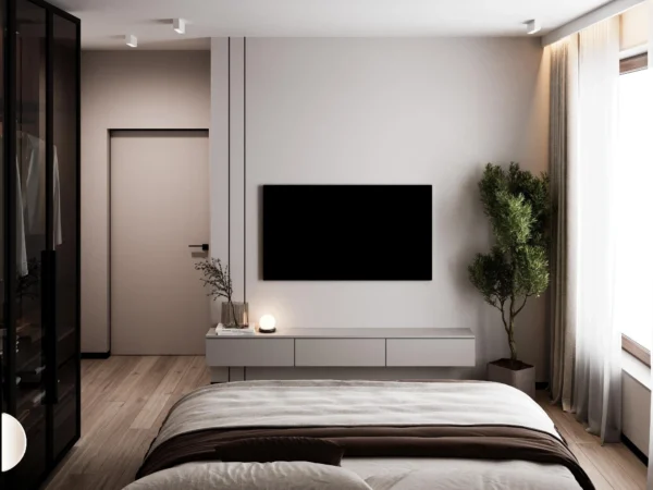 Wall opposite the bed: TV, floating console and an indoor tree
