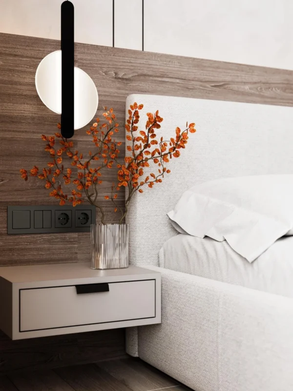 Bedroom detail: wall light, floating bedside table and wood panel behind the headboard