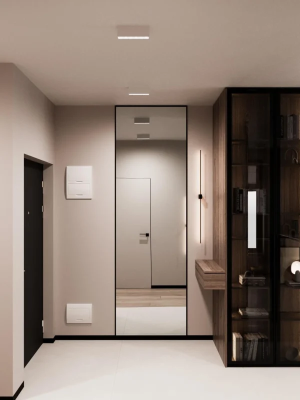 Entrance hall: full-height mirror, a console and an illuminated glass display cabinet
