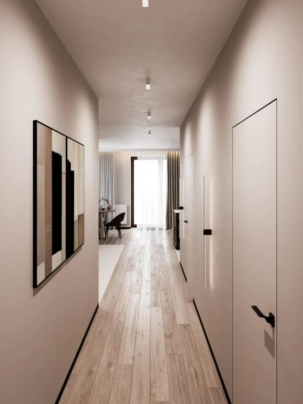 Corridor with graphic artwork, a linear wall light and a view to the living room