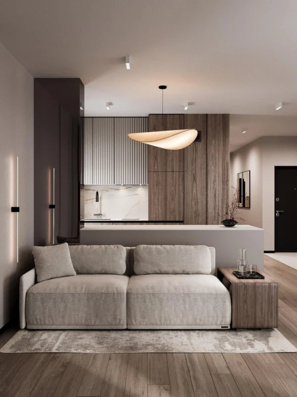 Light sofa against the kitchen island with a pendant light above the bar counter