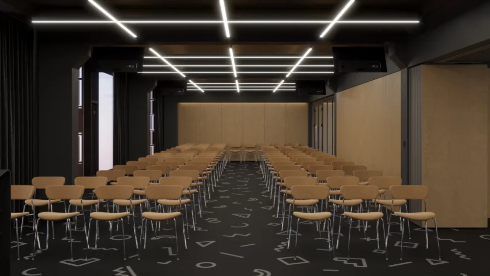 Hall closed off by a movable wood-look partition: rows of chairs and light lines on the ceiling