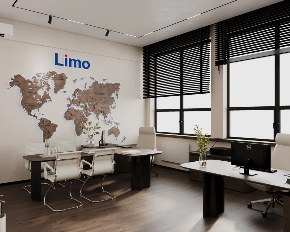 Office with a meeting table by a wooden world-map wall and a workstation by the window