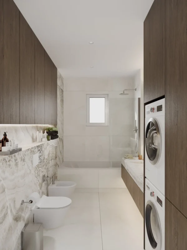 View of the bathroom: stacked washer and dryer, vanity and a bathtub with shower by the window
