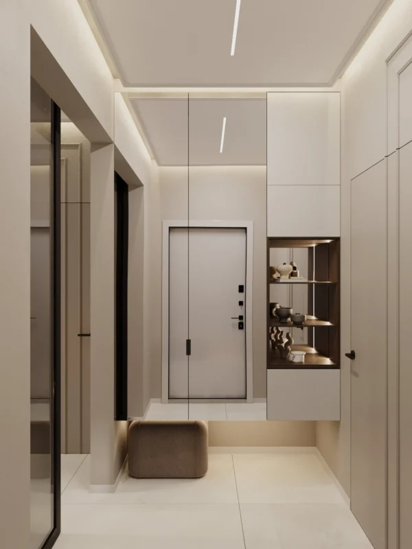 Entrance vestibule: front door, floating cabinet with a lit niche, upholstered pouf and a mirrored wall