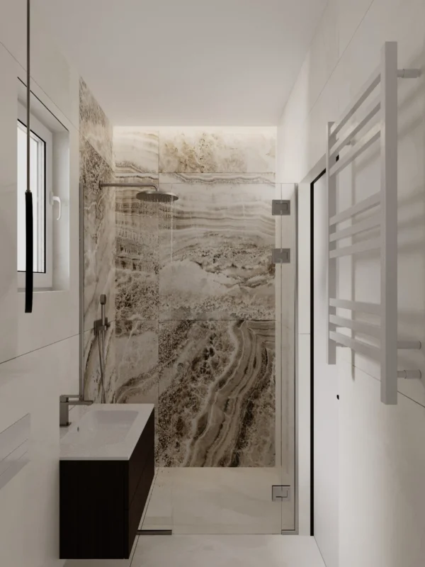 Shower with glass doors, a towel rail and a dark vanity unit