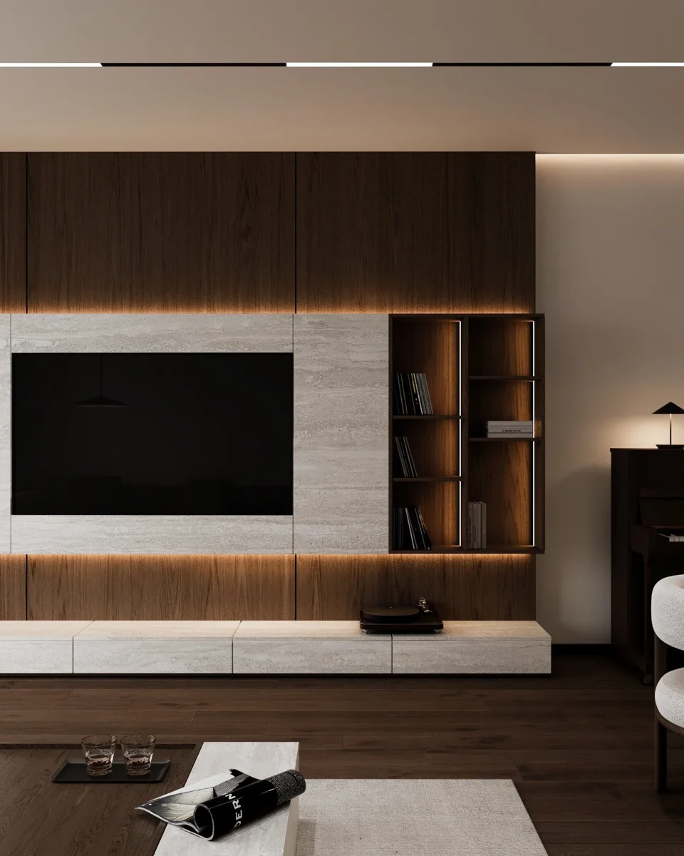TV area with an illuminated open shelving unit and a low console